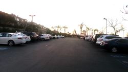 Gym parking lot full at sunrise